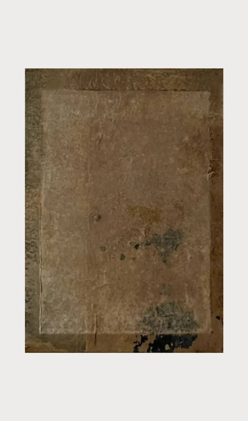 Untitled (GES#6) by Alexandra Yan Wong, a pale ochre rectangle of clay and paper inside a darker border with faint grey marks