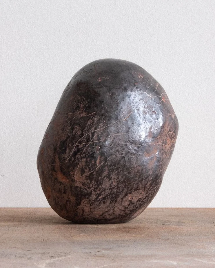 The Universe Was an Egg Which Cracked by Arran Gregory, seen from another side, showing fine cracks in the dark surface