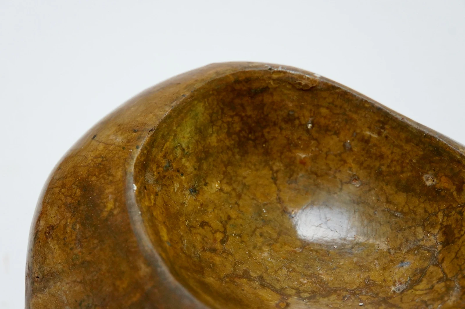Bedrock by Edie Evans, close-up of its hollow, showing the polished mottled surface
