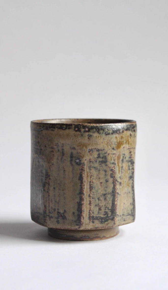 Cup I by James Galbraith Kirkpatrick, a short cup with a dark rim, patterned glaze and small foot