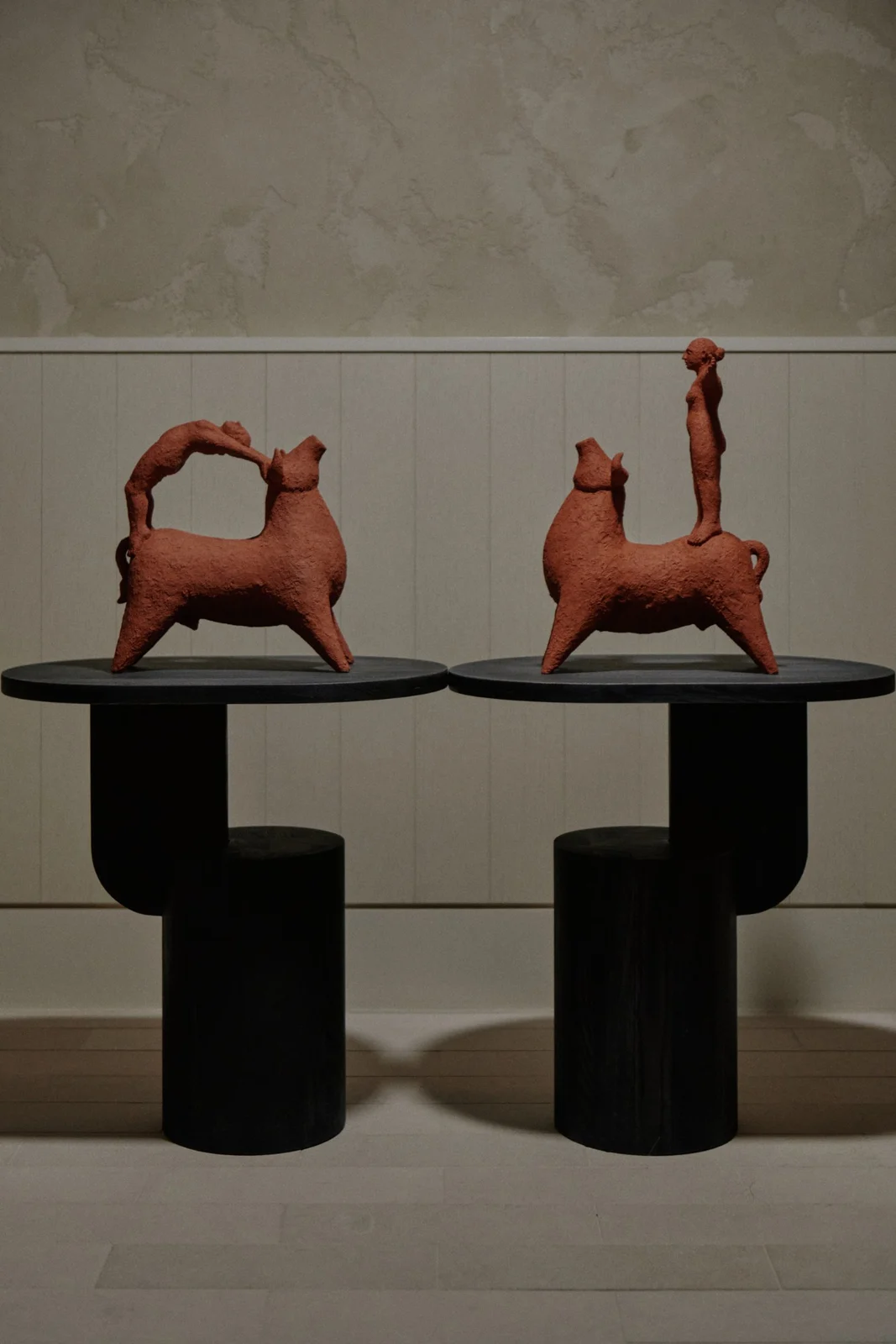 Zahed Tajeddin’s Bull Leaping II and Beauty and the Beast on black pedestals